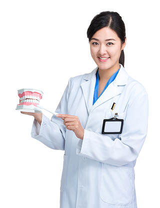 bigstock-Female-doctor-with-toothbrush--66710413