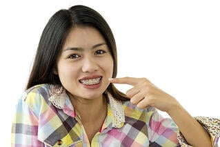bigstock-Asian-Beauty-With-Dental-Brace-39628048