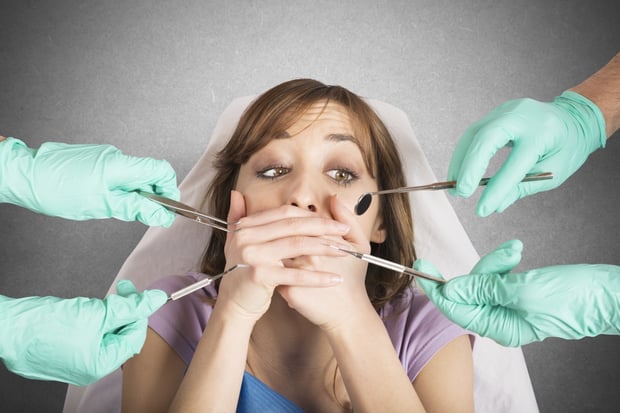 bigstock-Girl-frightened-by-dentists-88535333.jpg